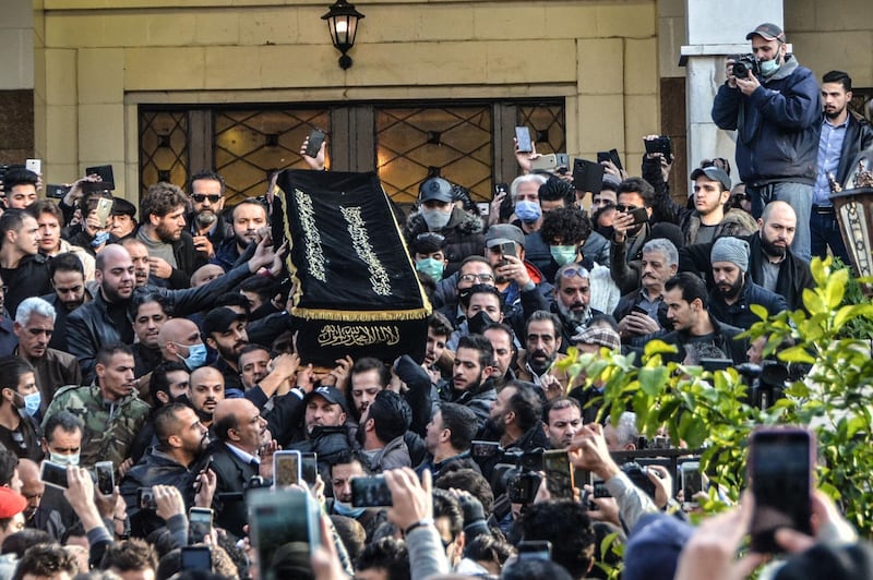 The casket of film director Hatem Ali is carried out of al-Hussein mosque in the Syrian capital Damascus. AFP
