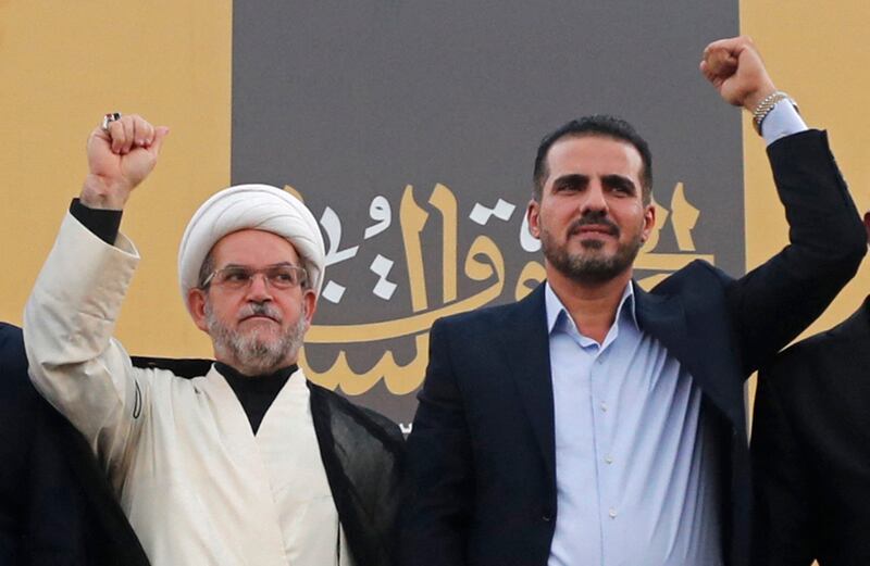 Abu Ali Al Askari, right, spokesman of Iraqi Kataeb Hezbollah, during a campaign rally in Baghdad. AFP