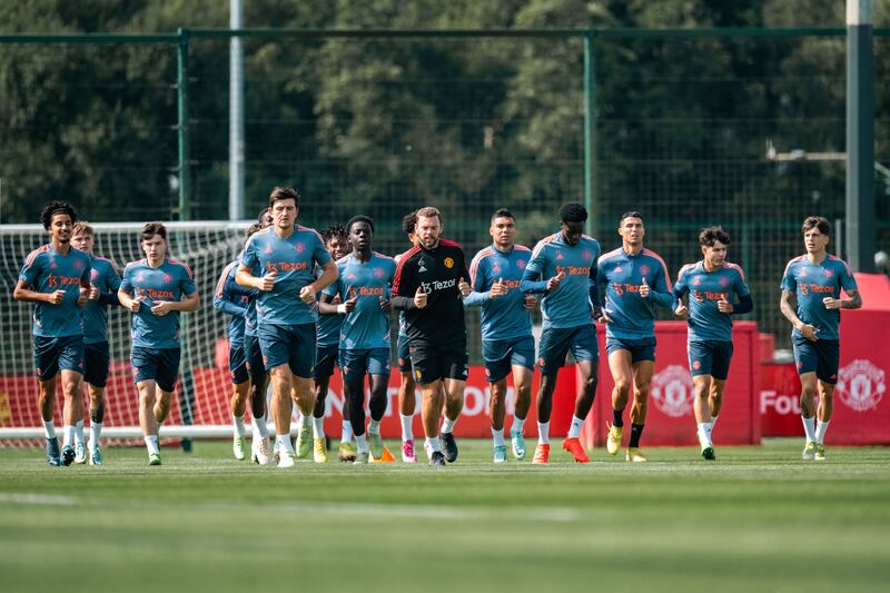 Zidane Iqbal, Daniel Gore, Harry Maguire, Omari Forson, Casemiro, Cristiano Ronaldo, Marc Jurado, and Alejandro Garnacho train with their Manchester United teammates. Getty