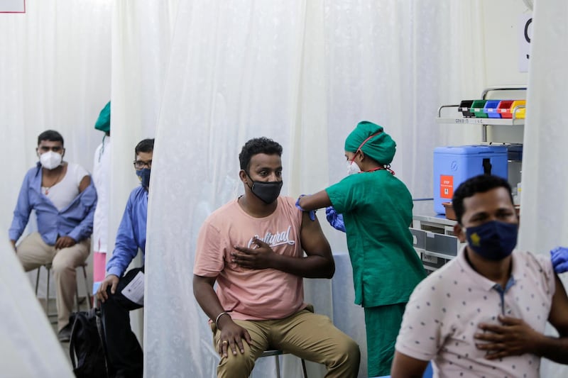 People are administered the Covid-19 vaccine in Mumbai, India. AP Photo
