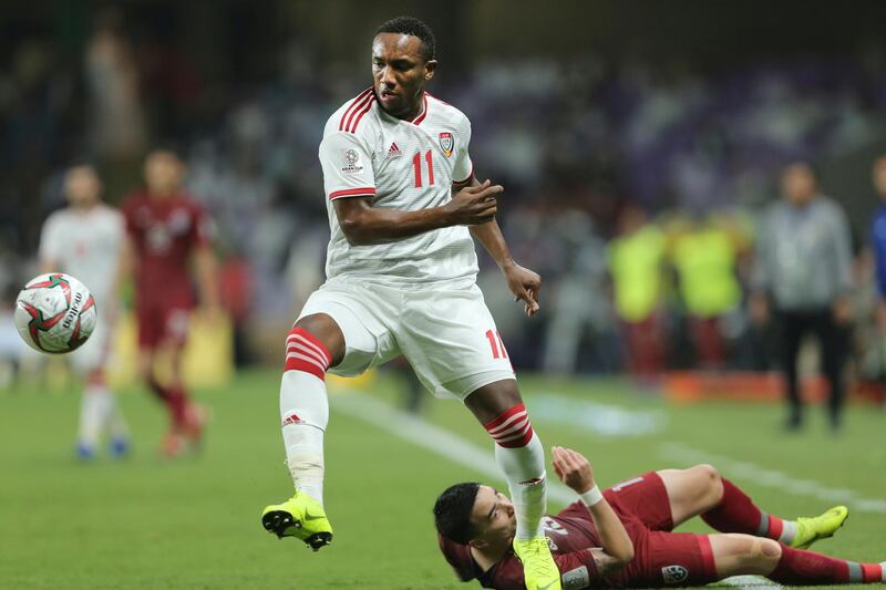 United Arab Emirates' Ahmed Khalil, left, and Thailand's Suphan Thongsong challenge for the ball during the AFC Asian Cup group A soccer match between United Arab Emirates and Thailand at Al Maktoum Stadium in Al Ain, United Arab Emirates, Monday, Jan. 14, 2019. (AP Photo/Kamran Jebreili)