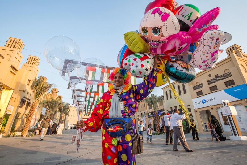 AL WATHBA, UNITED ARAB EMIRATES- A balloon vendor wearing a clown costume at Sheikh Zayed Heritage.  Leslie Pableo for The National
