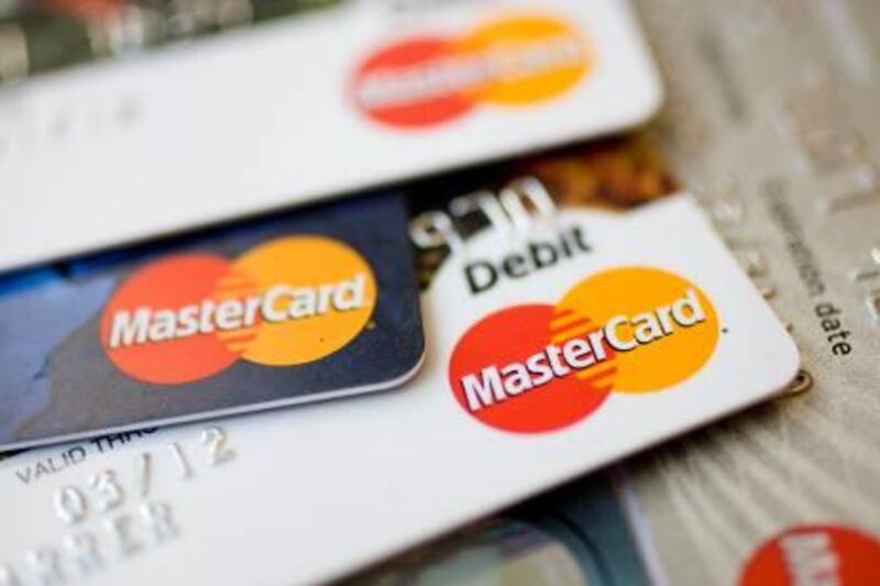 MasterCard logos appear on credit and debit cards arranged for a photograph in New York, U.S., on Thursday, July 30, 2009. MasterCard Inc., the world's second-biggest payment-card network, posted profit that beat analysts' estimates as the company raised fees and processed more transactions. Photographer: Andrew Harrer/Bloomberg 
 *** Local Caption ***  554054.jpg