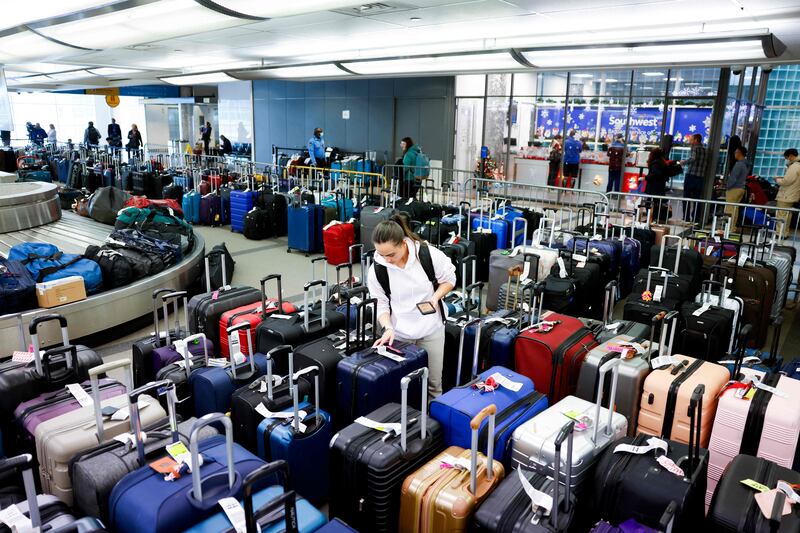 A Southwest baggage holding area in Denver. Thousands of travellers have faced cancelled flights due to bad weather. AFP