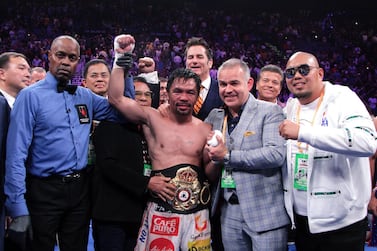 Filipino boxer Manny Pacquiao (C) celebrates after defeating US boxer Keith Thurman during their WBA super world welterweight title fight at the MGM Grand Garden Arena on July 20, 2019 in Las Vegas, Nevada. Pacquiao won a 12 round split decision. / AFP / John Gurzinski