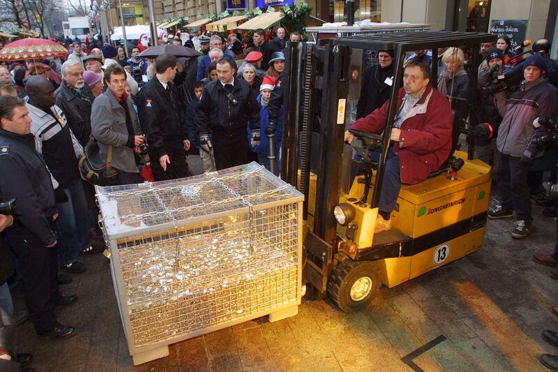 398746 12: A forklift moves 40,000 Euro coins at a Euro promotional event December 17, 2001 in Frankfurt, Germany, the day banks started distributing the first so-called Starter Kits of Euro coins to the German public. Twelve of the 15 European Union member states will officially adopt the Euro to replace their national currencies as of January 1, 2002. (Photo by Sean Gallup/Getty Images)