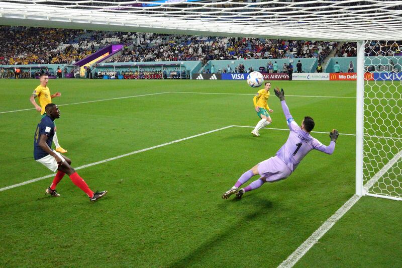 Craig Goodwin of Australia scores their first goal past Hugo Lloris of France. Getty