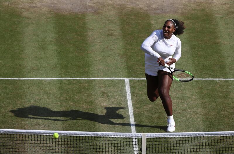 Serena Williams of the US returns a ball to Angelique Kerber of Germany in the women's singles final match at the Wimbledon Tennis Championships, in London, Saturday July 14, 2018. (John Walton/Pool via AP)