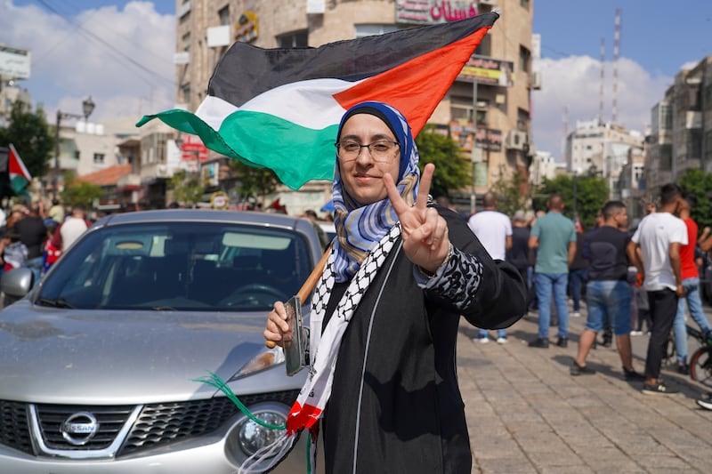 Nisren Salim holds up the peace sign, while attending a demonstration in Ramallah. Willy Lowry / The National