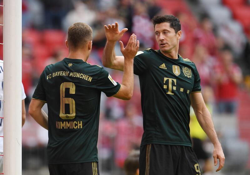 Bayern Munich's Joshua Kimmich celebrates scoring their sixth goal with Robert Lewandowski. Reuters