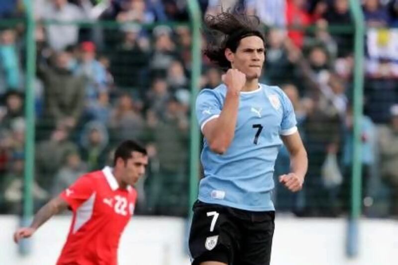Edinson Cavani, right, and Luis Suarez have finally gotten the chance to show how they fit in with a bunch of 23 year olds. A 6-4 win by the Uruguay side against Chile makes the formula look successful so far.