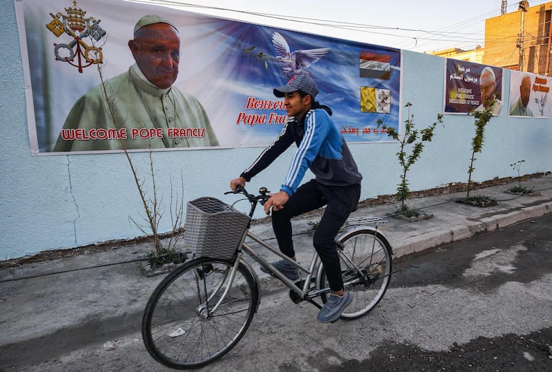 A poster of Pope Francis on the wall of the Chaldean Catholic Church of St Joseph in Baghdad. AFP