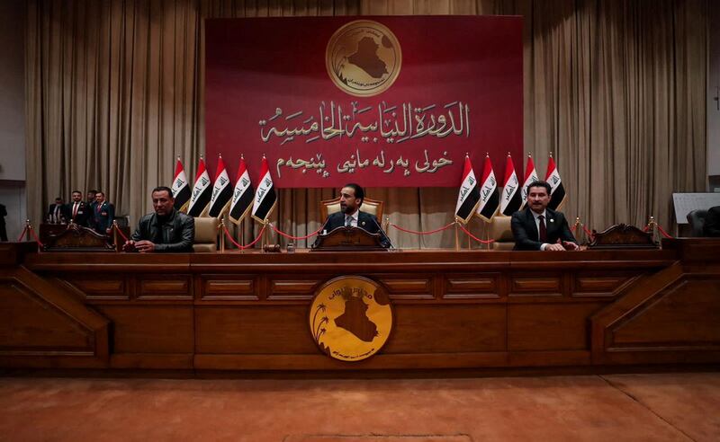 Iraq's speaker of parliament Mohammed Al Halbousi, centre, and his deputies Hakim Al Zamili and Shakhwan Abdulla in Baghdad on January 9, 2022. Reuters