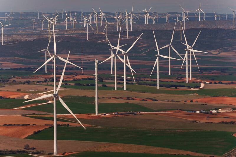 Wind turbines on a wind farm in Villar de los Navarros, Zaragoza province, Spain. New data released by Irena shows that renewable energy kept growing in 2021 despite global uncertainties. AFP