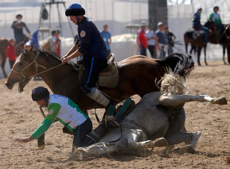 Uzbek and French horsemen take part in kok-boru. EPA