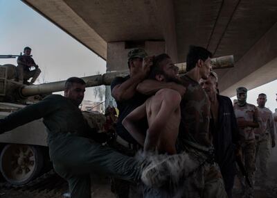 IRAQ, Mosul: An alleged ISIS fighter is mistreated by Iraqi armi soldiers right after being captured on the frontline in the old city of Mosul. Alessio Romenzi