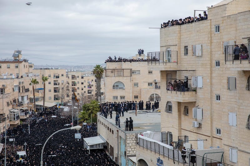 Thousands of ultra-Orthodox Jews participate in the funeral of Rabbi Meshulam Dovid Soloveitchik. AP