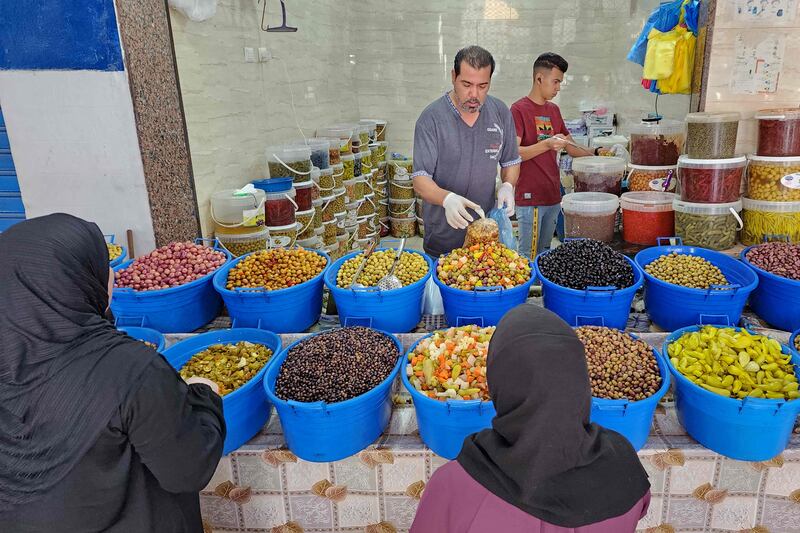Shoppers at a market in Tripoli on October 5, 2022 ahead of celebrations to marking the birth of Prophet Mohammed, known in Arabic as 'Mawlid al-Nabawi'. AFP