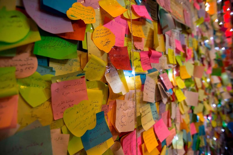 A "wishing wall" set up by demonstrators is seen in Tahrir Square. AFP