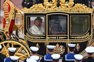 King Charles III in the Diamond Jubilee Coach built in 2012 to commemorate the 60th anniversary of the reign of Queen Elizabeth II, in London. Getty Images
