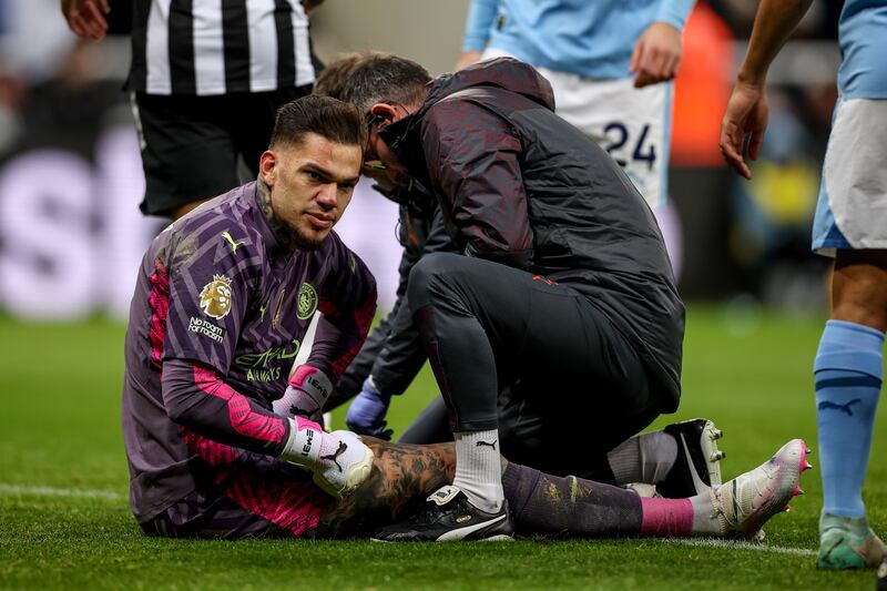 City's Ederson is treated before his eventual substitution due to injury. EPA