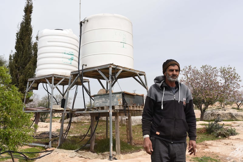 Assam Abu Murad beside his home in Susiya, a village in the southern West Bank. Rosie Scammell / The National