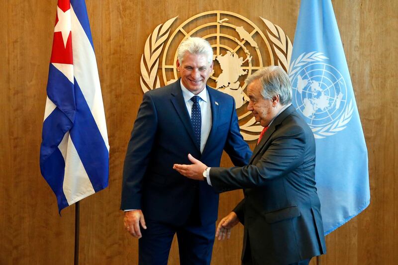 Cuba's President Miguel Diaz-Canel Bermudez is directed towards the guest book by United Nations Secretary-General Antonio Guterres as they meet on the sidelines of the United Nations General Assembly. AP