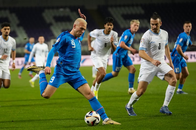 Iceland's Jon Dagur Thorsteinsson on the ball in front of Israel's Shon Goldberg. AP