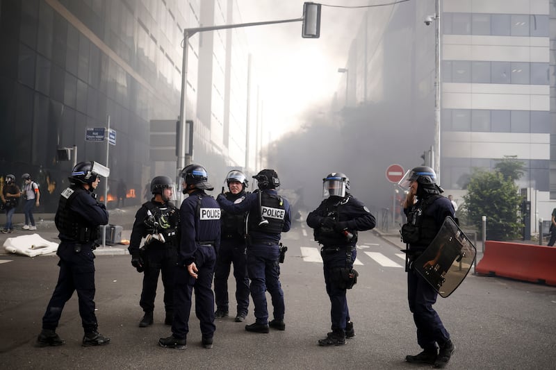 French riot police after clashing with protesters during the march. EPA