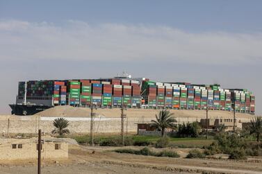 Ever Given, one of the world's largest container ships, is banked in the Suez Canal while authorities demand compensation from the owners. Reuters
