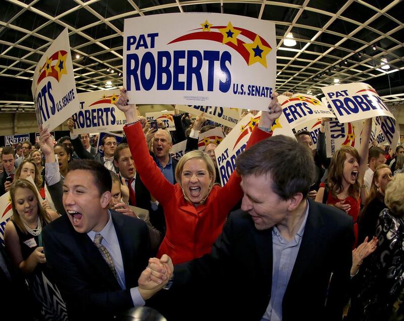 Supporters cheer before Republican Senator for Kansas  Pat Roberts makes his victory speech. (Charlie Riedel / AP)