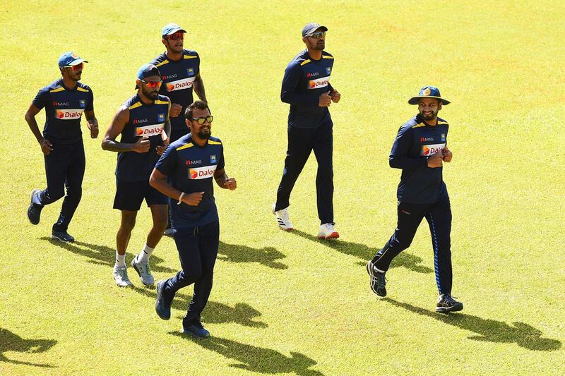 Sri Lanka cricketers warm up at the Colombo Colts Cricket Stadium. AFP