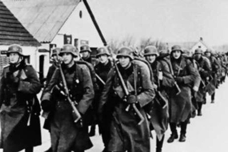 "Denmark's initial passivity before the Nazis is a large-scale version of the icy inaction that grips their family": German troops march into the city of Aalborg on the first day of occupation.
