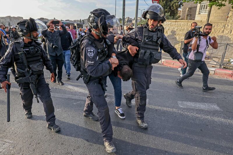 Israeli security forces detain a Palestinian. AFP