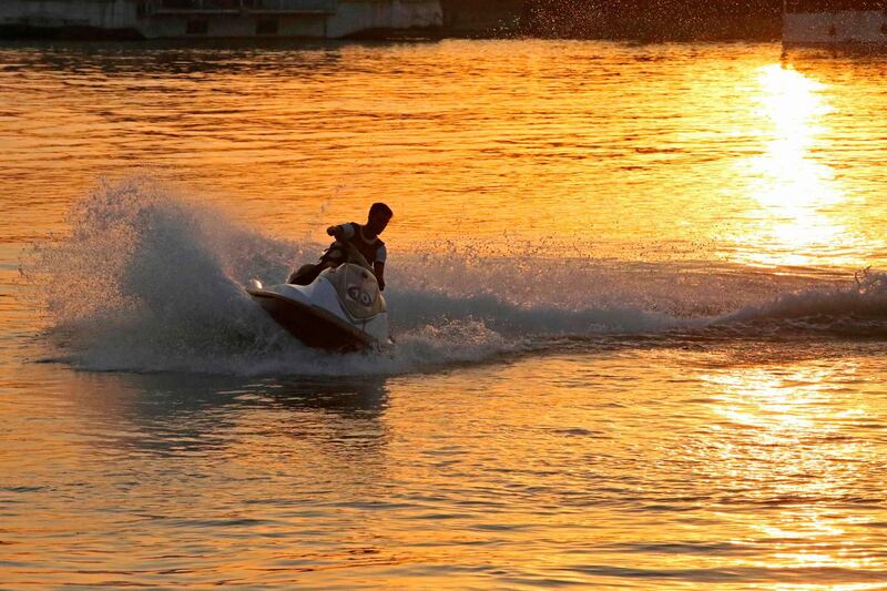 An Iraqi rides a jet-ski on the river Tigris, in the Adhamiya district of Iraq's capital Baghdad. AFP