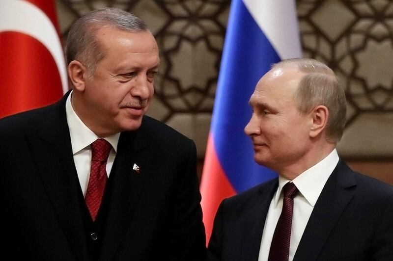 (FILES) This file photo taken on April 4, 2018 shows Turkey's President Recep Tayyip Erdogan (L) and Russia's President Vladimir Putin looking at each other during a joint press conference with the Iranian president, as part of a tripartite summit on Syria, in Ankara. Turkish President Recep Tayyip Erdogan will meet with his Russian counterpart Vladimir Putin on September 17, 2018 amid rising international concern over a looming Syrian government assault in the Idlib province, officials said. / AFP / ADEM ALTAN
