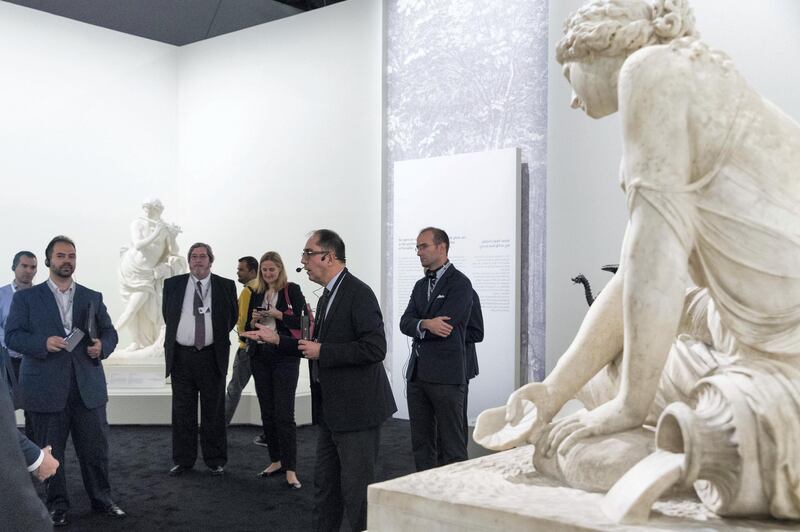 Abu Dhabi, United Arab Emirates, December 19, 2017:    Jean-Luc Martinez president-director of Musee du Louvre and chief curator of the exhibition, 2nd left, leads journalists through a preview of the, From One Louvre to Another exhibit, at the Louvre Abu Dhabi on Saadiyat Island in Abu Dhabi on December 19, 2017. The exhibit will be open from December 21st to April 7, 2018. Christopher Pike / The National

Reporter: John Dennehy
Section: News