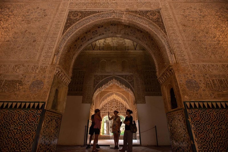 Tourists admire the Nasrid Palaces of the Alhambra, Granada. Photo by Kira Walker