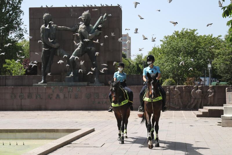 Turkish mounted police officers patrol the Kizilay National Will Square in Ankara. AFP