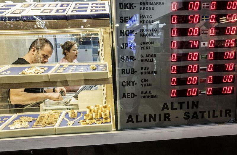 International currency exchange rates on  display beside the window of a gold vendor in the Grand Bazaar market in Istanbul, Turkey, on Tuesday, July 19, 2016. Ismail Ferdous/Bloomberg
