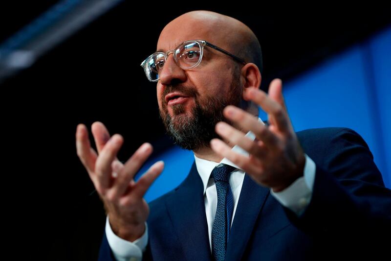 European Council President Charles Michel gestures as he talks during a press conference marking his first year as President at the European Council headquarters in Brussels, on December 4, 2020. / AFP / POOL / Francisco Seco
