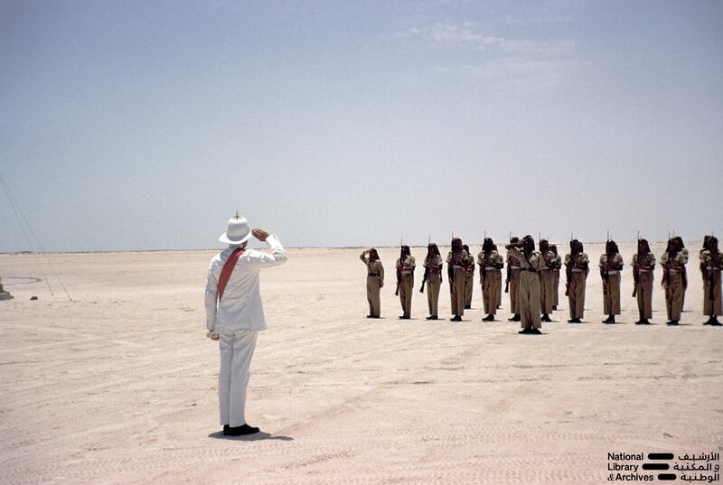 Sir William Luce, the British Political Resident in Bahrain, acknowledging a guard of honour, in Abu Dhabi in the early 1960s. Dr Alan Horan © UAE National Library and Archives