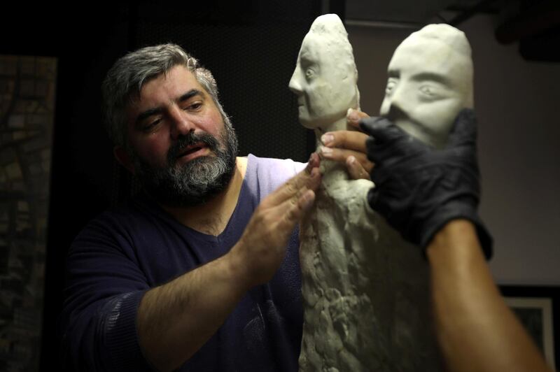 Omar Sartawi, a Jordanian chef recreates an ancient statue found in Jordan using a famous local product - Jameed (dried goat's milk used in the country's national dish), at his workshop in Amman, Jordan. REUTERS
