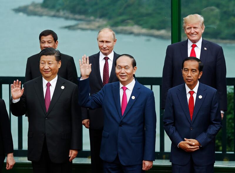 FILE - In this Nov. 11, 2017, file photo, leaders pose during the family photo session at the APEC Summit in Danang, Vietnam Front left to right; China's President Xi Jinping, Vietnam's President Tran Dai Quang, Indonesia's President Joko Widodo, back left to right; Philippines' President Rodrigo Duterte, Russia's President Vladimir Putin, U.S. President Donald Trump. (Jorge Silva/Pool Photo via AP, File)