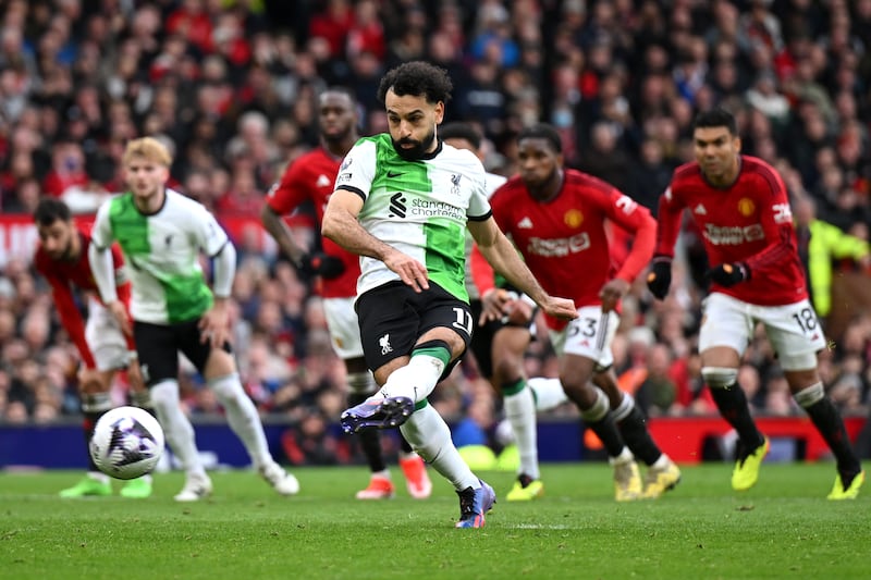 Mohamed Salah of Liverpool scores his team's second goal against Manchester United from the penalty spot in the 2-2 Premier League draw at Old Trafford on April 7, 2024. Getty Images