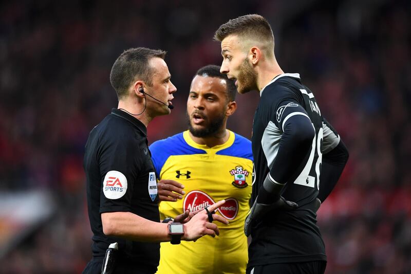 Alex McCarthy of Southampton argues with referee Stuart Attwell. Getty Images
