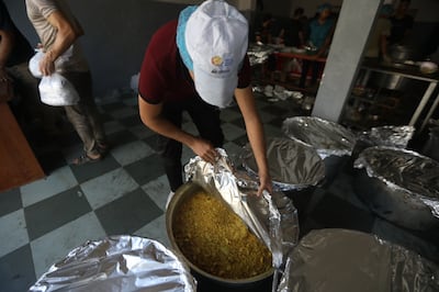 Staff prepare to distribute meals for people in Gaza. Photo: Dubai Cares