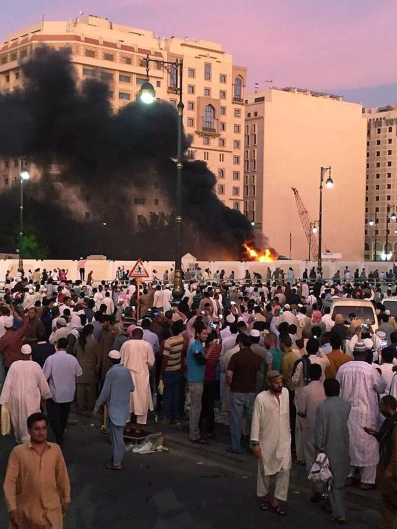 Worshippers gather after a suicide bomber detonated a device near the security headquarters of the Prophet's Mosque in Medina, July 4, 2016. REUTERS/Handout 