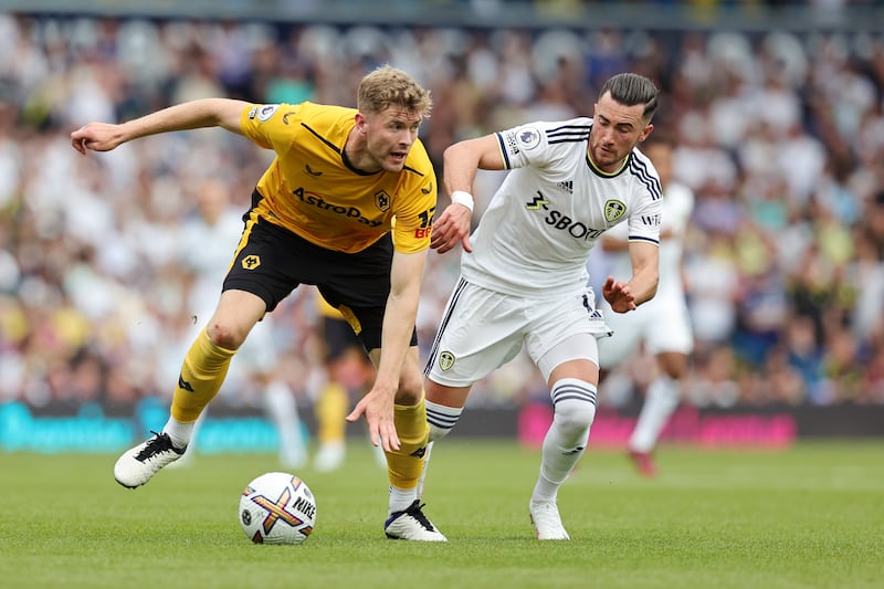 Nathan Collins of Wolverhampton Wanderers is challenged by Jack Harrison of Leeds United. Getty