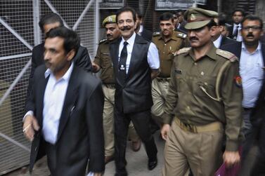 Sahara group chairman Subrata Roy is escorted by police to a court in the northern Indian city of Lucknow. Reuters